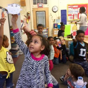 Children play out a story with clothespin puppets